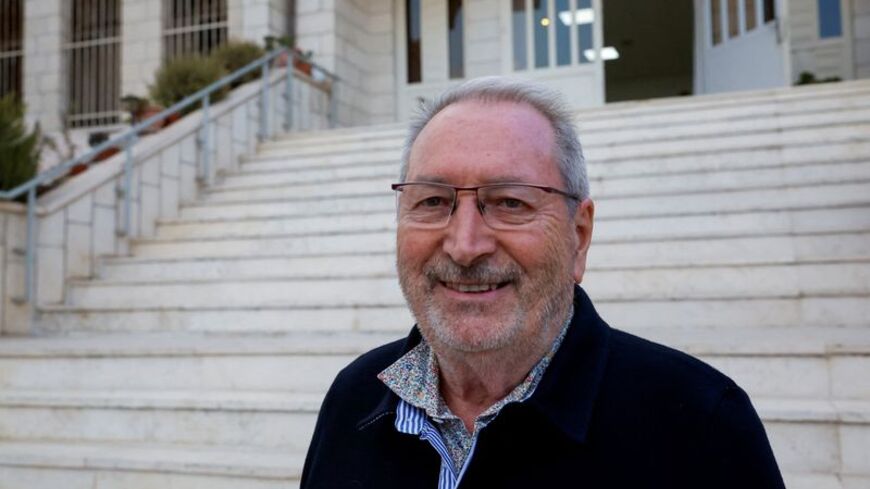 Bernard Baudoux, mayor of Aulnoye-Aymeries, poses for a photograph after he was attacked by militant Israeli settlers