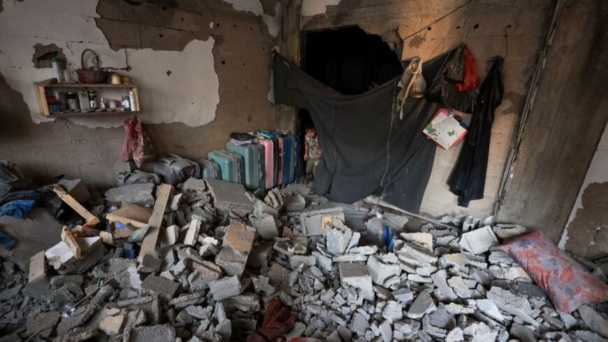Aftermath of Israeli strike on an apartment, in Gaza City