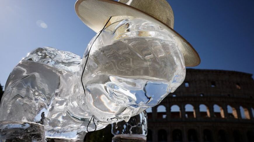 Greenpeace activists place ice statues near the Colosseum in Rome