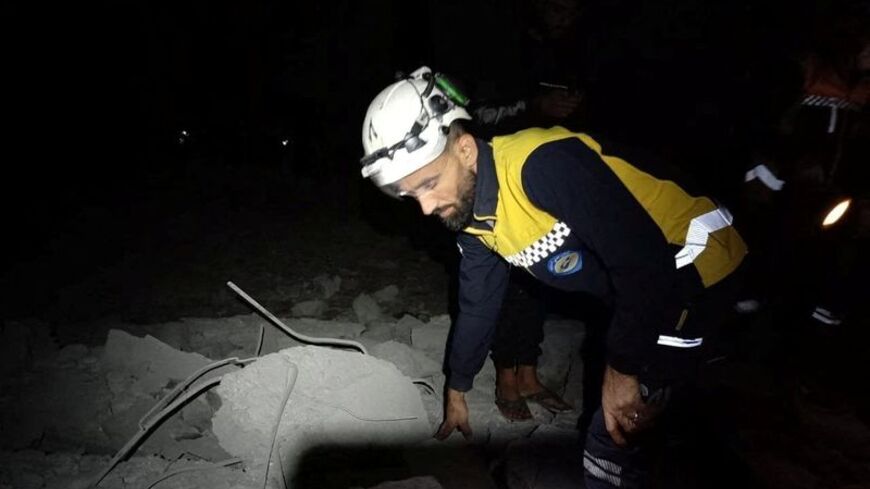 White Helmets members take part in rescue operations in the aftermath of Jordanian airstrikes in locations given as Daraa Governorate and As-Suwayda Governorate