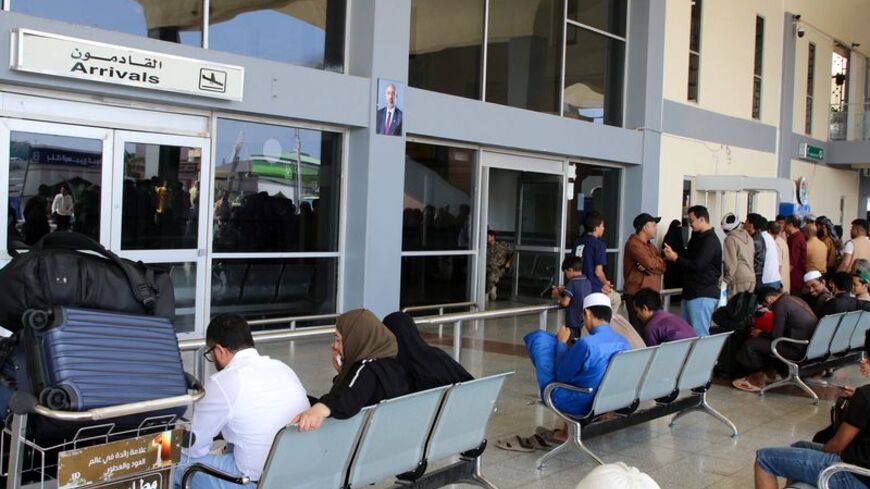 Passengers wait for their flights at Aden Airport in Aden