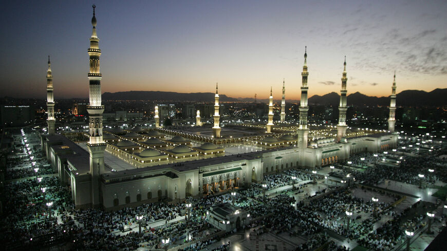 The Prophet Mohammed Mosque is lit during the sunset prayers in the holy Saudi city of Medina 11 January 2005. Saudi Arabia began receiving Muslim pilgrims early this month in preparation for the annual hajj (pilgrimage), scheduled to take place in the last two weeks of January. Islam's Prophet Mohammed is buried in Medina's landmark mosque, which is Islam's second holiest shrine. All Muslims are required to make the pilgrimage to the Muslim holy city of Mecca, one of the five pillars of Islam, at least onc