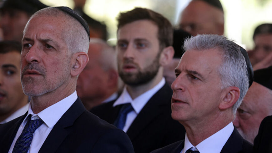Israel's Chief of the Mossad David Barnea (R) and Security Agency director Ronen Bar, attend a ceremony marking the Hebrew calendar anniversary of the Hamas attack on October 7 last year that sparked the ongoing war in Gaza, at the Mount Herzl military cemetery in Jerusalem on October 27, 2024. (Photo by GIL COHEN-MAGEN / POOL / AFP) (Photo by GIL COHEN-MAGEN/POOL/AFP via Getty Images)