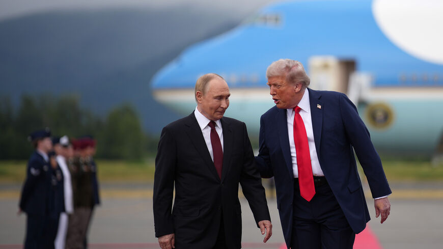 ANCHORAGE, ALASKA - AUGUST 15: U.S. President Donald Trump (R) walks with Russian President Vladimir Putin as they arrives at Joint Base Elmendorf-Richardson on August 15, 2025 in Anchorage, Alaska. The two leaders are meeting for peace talks aimed at ending the war in Ukraine. (Photo by Andrew Harnik/Getty Images)