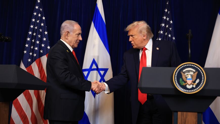 US President Donald Trump shakes hands with Israeli Prime Minister Benjamin Netanyahu during a press conference at his Mar-a-Lago club on Dec. 29, 2025, in Palm Beach, Florida.