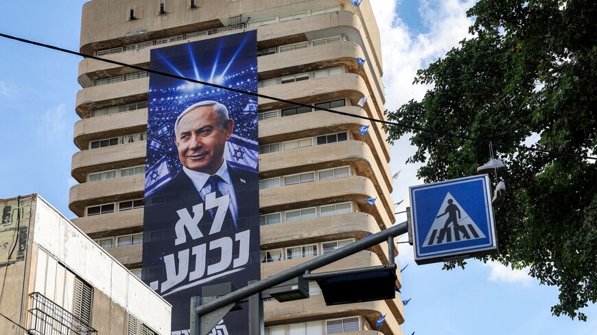 A giant electoral poster for Israeli Prime Minister Benjamin Netanyahu's Likud party with the slogan "no surrender" is displayed on the facade of a building in Tel Aviv on Sept. 29, 2026