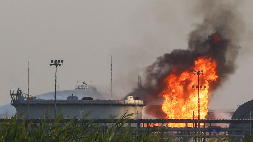Flames burn at a facility belonging to Saudi oil giant Aramco south of Riyadh