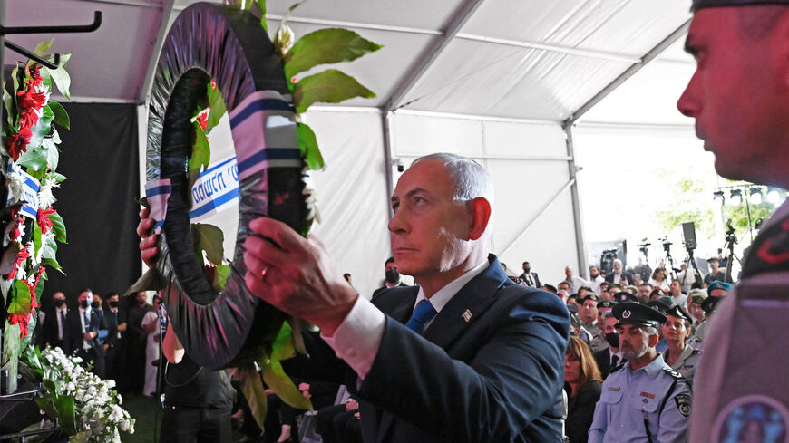 Israeli Prime Minister Benjamin Netanyahu lays a wreath during the state memorial ceremony for the third anniversary of the Oct. 7 attack, at Mount Herzl military cemetery, Jerusalem, Oct. 5, 2026.