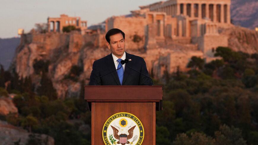 U.S. Secretary of State Marco Rubio speaks at the Pnyx hill, where ancient Athenians held democratic assemblies, with the ancient Parthenon temple atop the Acropolis seen in the background, in Athens on October 7, 2026. (Photo by Mark Schiefelbein / POOL / AFP via Getty Images)
