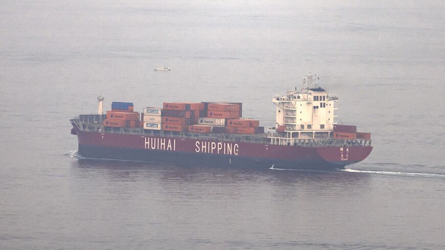 The Chinese-flagged container shipping vessel Hui Fa transits the Gulf of Oman off the coast of Khor Fakkan in the emirate of Sharjah east of the UAE, on Oct. 13, 2026. 