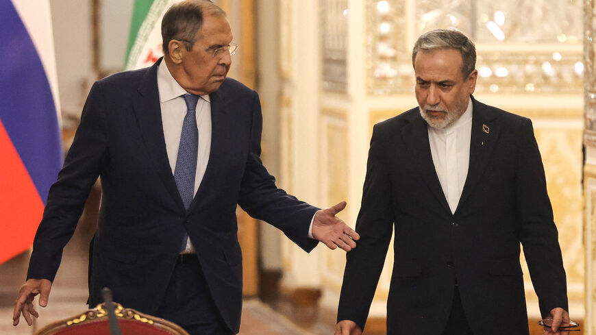 Russia's Foreign Minister Sergey Lavrov (L) and Iran's Foreign Minister Abbas Araghchi arrive to hold a press conference after a meeting in Tehran on October 19, 2026. The Russian foreign minister arrived in Iran on October 19, in his first visit since the outbreak of the Middle East war as Moscow seeks to play a mediating role. (Photo by ATTA KENARE / AFP via Getty Images)
