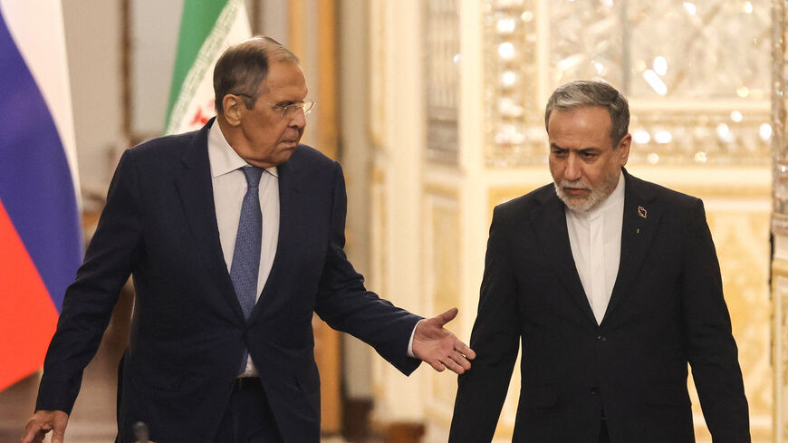Russia's Foreign Minister Sergey Lavrov (L) and Iran's Foreign Minister Abbas Araghchi arrive to hold a press conference after a meeting in Tehran on October 19, 2026. The Russian foreign minister arrived in Iran on October 19, in his first visit since the outbreak of the Middle East war as Moscow seeks to play a mediating role. (Photo by ATTA KENARE / AFP via Getty Images)