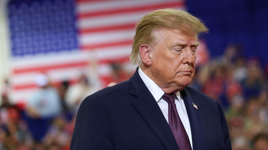 US President Donald Trump walks on stage