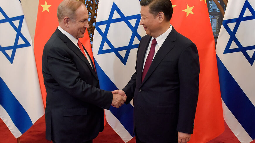 China's President Xi Jinping (R) and Israel's Prime Minister Benjamin Netanyahu shake hands ahead of their talks at Diaoyutai State Guesthouse in Beijing on March 21, 2017.