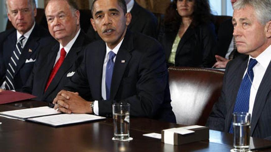 U.S. President Barack Obama (2nd R) and Vice President Joe Biden (L) meet with co-chairmen of the President's Intelligence Advisory Board former Senator Chuck Hagel (R-NE) (R) and former Senator David Boren (D-OK) and senior leadership of the intelligence community in the Cabinet Room at the White House in Washington October 28, 2009.    REUTERS/Jim Young    (UNITED STATES POLITICS)