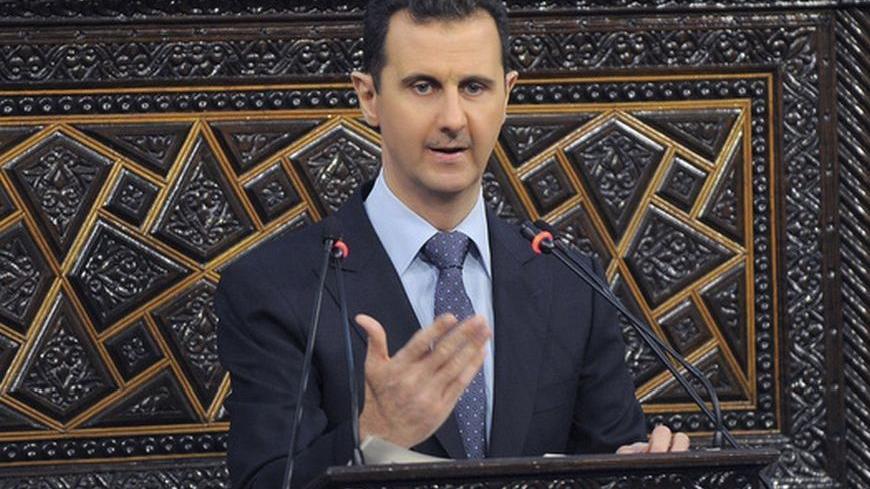Syria's President Bashar al-Assad delivers a speech to Syria's parliament in Damascus, June 3, 2012, in this handout photograph released by Syria's national news agency SANA. al-Assad on Sunday condemned the "abominable" massacre of more than 100 people in Houla, saying even monsters could not carry out such acts, and promised a 15-month-old crisis would end soon if Syrians pulled together. REUTERS/SANA/Handout (SYRIA - Tags: POLITICS CIVIL UNREST) FOR EDITORIAL USE ONLY. NOT FOR SALE FOR MARKETING OR ADVER