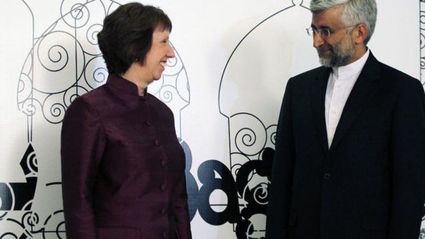 European Union foreign policy chief Catherine Ashton (L) and Iran's chief negotiator Saeed Jalili pose for the media before their meeting in Baghdad May 23, 2012.    REUTERS/Thaier al-Sudani (IRAQ - Tags: POLITICS)