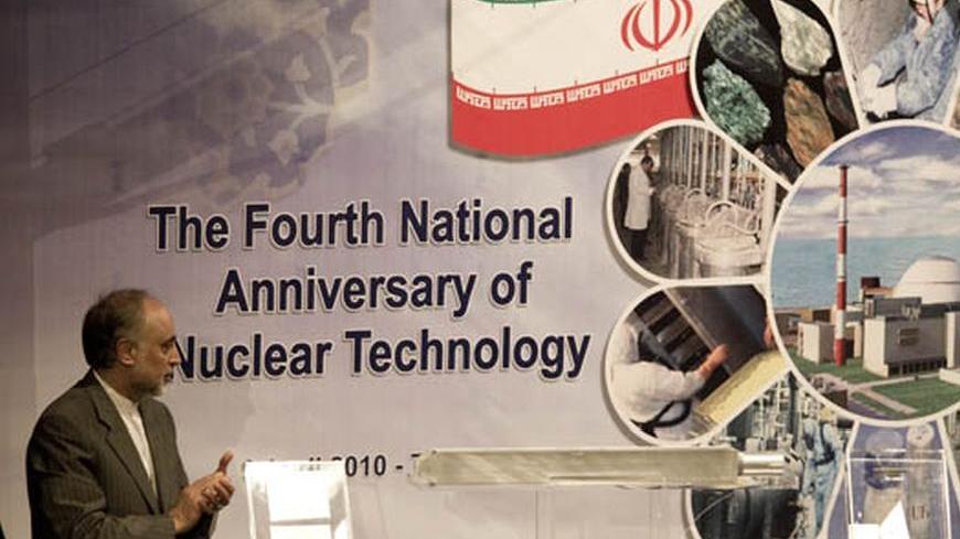 EDITORS' NOTE: Reuters and other foreign media are subject to Iranian restrictions on leaving the office to report, film or take pictures in Tehran. 

Ali Akbar Salehi, head of Iran's Atomic Energy Organisation, claps as he looks at an object representing nuclear fuel which will be used in Tehran's research reactor during a ceremony to mark the Fourth National Anniversary of Nuclear Technology, in Tehran April 9, 2010. Iran announced Friday it had developed faster centrifuges for uranium enrichment, signall
