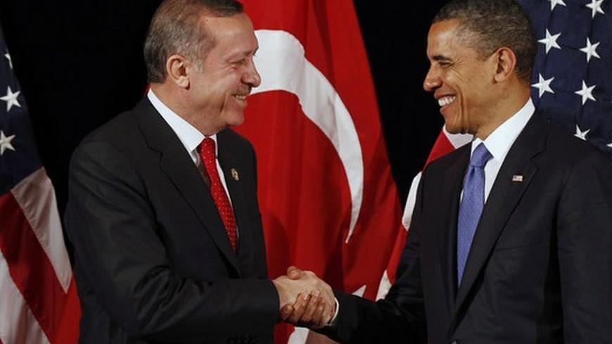 U.S. President Barack Obama (R) shakes hands with Turkey's Prime Minister Recep Tayyip Erdogan after a bilateral meeting ahead of the Nuclear Security Summit in Seoul March 25, 2012.     REUTERS/Larry Downing        (SOUTH KOREA - Tags: POLITICS MILITARY)