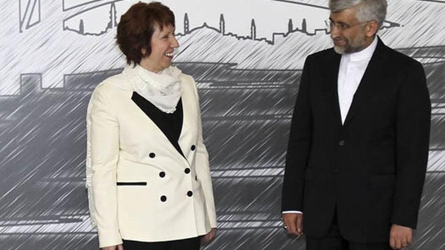 European Union foreign policy chief Catherine Ashton (L) and Iran's chief negotiator Saeed Jalili pose for media before their meeting in Istanbul April 14, 2012. World powers and Iran launched a new round of negotiations in Istanbul on Saturday, aiming to resolve a long-standing dispute over Tehran's nuclear programme that threatens to spark a new war in the Middle East. REUTERS/Tolga Adanali/Pool (TURKEY - Tags: POLITICS)