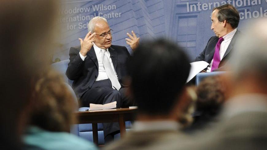 Senior Palestinian negotiator Saeb Erekat (L) speaks during a question-and-answer forum with moderator Aaron David Miller (R) at the Woodrow Wilson Center in Washington, November 4, 2010.    REUTERS/Jonathan Ernst    (UNITED STATES - Tags: POLITICS)