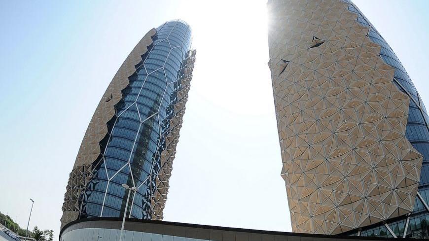 Al Bahar Towers are seen in Abu Dhabi, September 11, 2012. A particular feature of the building is the "Mashrabiya" a unique, dynamic solar shading system made up of individual units designed to open and close during the course of each day in response to the movement of the sun. REUTERS/Ben Job (UNITED ARAB EMIRATES - Tags: REAL ESTATE BUSINESS)