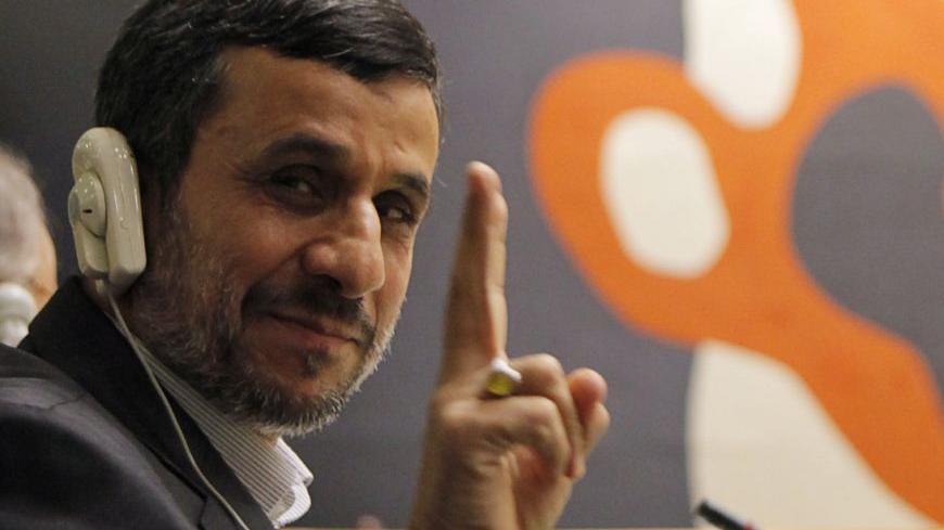 Iran's President Mahmoud Ahmadinejad flashes the peace sign during the high-level meeting of the General Assembly on the Rule of Law at the United Nations headquarters in New York September 24, 2012. REUTERS/Eduardo Munoz (UNITED STATES - Tags: POLITICS)