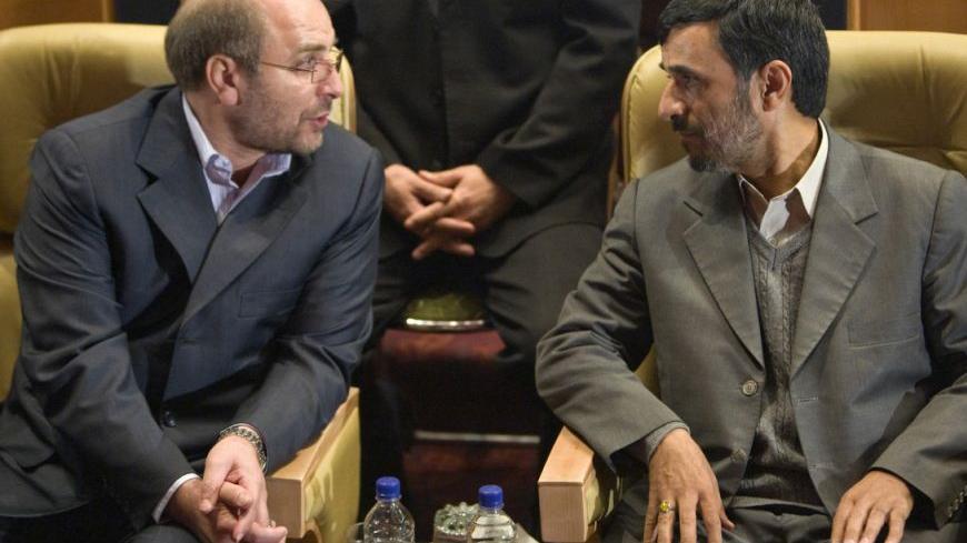 Former Police Chief and Tehran Mayor Mohammad-Baqer Qalibaf (L) speaks with Iran's President Mahmoud Ahmadinejad as they attend the opening of the first Asian Mayors Forum in Tehran November 19, 2008. REUTERS/Morteza Nikoubazl (IRAN)