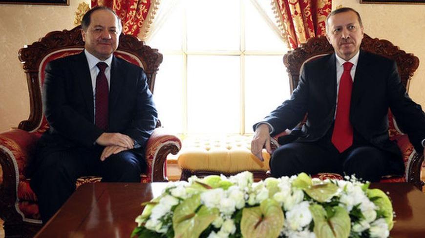 Turkish Prime Minister Tayyip Erdogan (R) and Kurdistan Regional President Masoud Barzani pose for the media before their meeting in Istanbul April 19, 2012. REUTERS/Stringer/Pool (TURKEY - Tags: POLITICS)