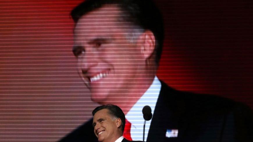 Republican presidential nominee Mitt Romney smiles as he arrives onstage to accept the nomination during the final session of the Republican National Convention in Tampa, Florida, August 30, 2012.  REUTERS/Adrees Latif (UNITED STATES  - Tags: ELECTIONS POLITICS)