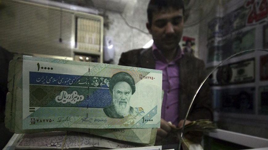 Iranian rial banknotes are seen at a currency exchange shop in Kerbala, 110 km (70 miles) south of Baghdad January 27, 2012. In the money changing shops dotted around Baghdad's Karrada district, Iraqi merchants dabble in many currencies, but these days some joke that banknotes from neighbouring Iran and Syria are only worth plastering on windows as decorations. Picture taken January 27, 2012. To match Feature IRAQ-SANCTIONS/     REUTERS/Mushtaq Muhammed (IRAQ - Tags: SOCIETY BUSINESS)