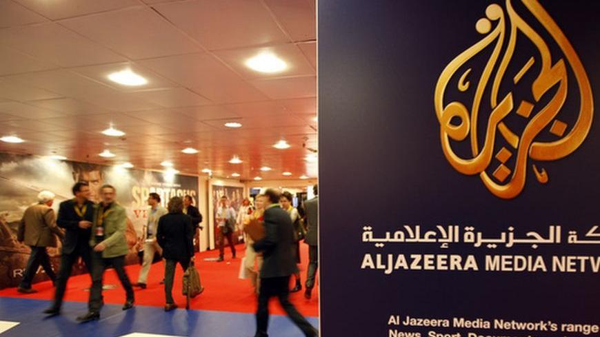 The logo of  Al Jazeera Media Network is seen at the MIPTV, the International Television Programs Market, event in Cannes April 2, 2012.         REUTERS/Eric Gaillard (FRANCE - Tags: ENTERTAINMENT BUSINESS)