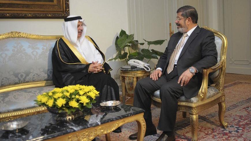Egypt's first Islamist president Mohamed Mursi (R) meets with Saudi Arabia's ambassador to Egypt Ahmed Kattan at the presidential palace in Cairo July 7, 2012.     REUTERS/Egyptian Presidency/Handout (EGYPT - Tags: POLITICS CIVIL UNREST) FOR EDITORIAL USE ONLY. NOT FOR SALE FOR MARKETING OR ADVERTISING CAMPAIGNS. THIS IMAGE HAS BEEN SUPPLIED BY A THIRD PARTY. IT IS DISTRIBUTED, EXACTLY AS RECEIVED BY REUTERS, AS A SERVICE TO CLIENTS