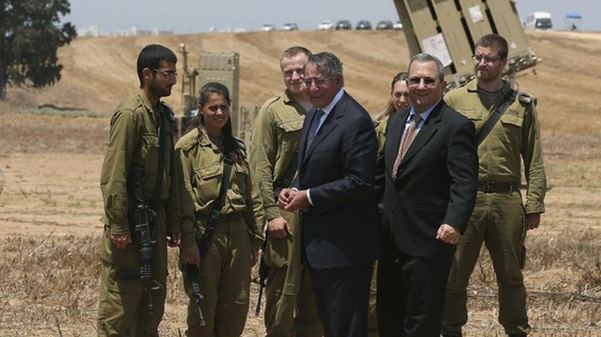 U.S. Defense Secretary Leon Panetta and Israeli Defense Minister Ehud Barak (front, R) greet Israeli soldiers after a joint news conference during a visit to the Iron Dome defense system launch site in Ashkelon August 1, 2012. Israel told Panetta on Wednesday that time was running out for a peaceful settlement to the nuclear dispute with Iran because sanctions and tough talk over possible military action were failing to sway Tehran. The Iron Dome was designed to intercept and destroy short-range shells and 