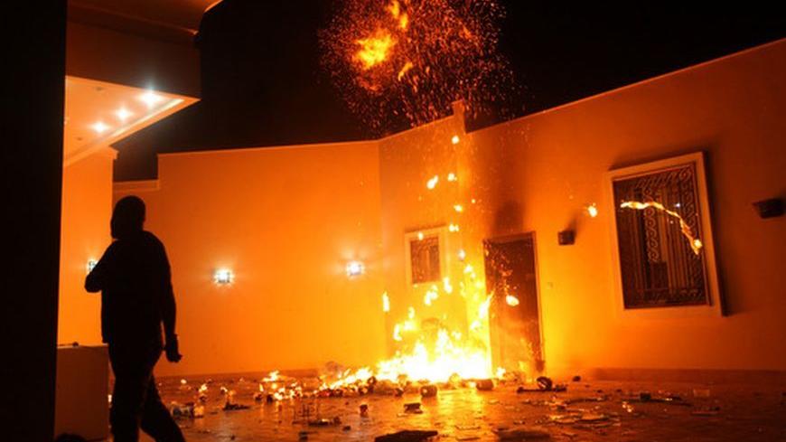 The U.S. Consulate in Benghazi is seen in flames during a protest by an armed group said to have been protesting a film being produced in the United States September 11, 2012. An American staff member of the U.S. consulate in the eastern Libyan city of Benghazi has died following fierce clashes at the compound, Libyan security sources said on Wednesday. Armed gunmen attacked the compound on Tuesday evening, clashing with Libyan security forces before the latter withdrew as they came under heavy fire. REUTER