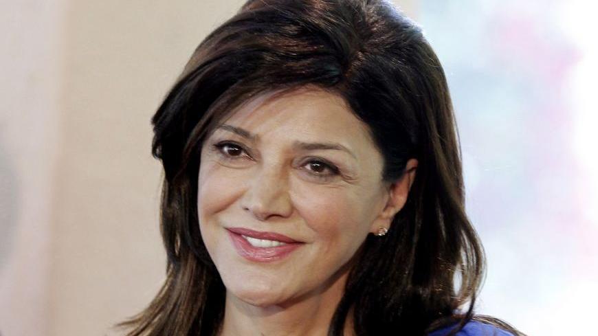 Actress Shohreh Aghdashloo arrives for the Hollywood Foreign Press Association annual installation luncheon in Beverly Hills, California August 4, 2011. The association also presented financial grants to film schools and non-profit organizations at the event.  REUTERS/Fred Prouser  (UNITED STATES - Tags: ENTERTAINMENT)
