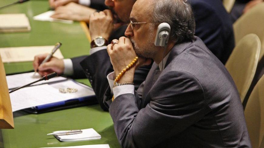 Iran's Foreign Minister Ali Akhbar Salehi listens to U.S. President Barack Obama as he addresses the 66th United Nations General Assembly at the U.N. headquarters in New York, September 21, 2011.  REUTERS/Jessica Rinaldi (UNITED STATES - Tags: POLITICS)