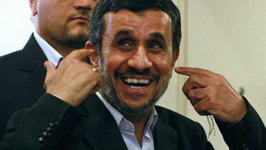Iranian President Mahmoud Ahmadinejad reponds to a reporters' questions following a news conference on the sidelines of the 67th United Nations General Assembly in New York, September 26, 2012.   REUTERS/Brendan McDermid (UNITED STATES - Tags: POLITICS)