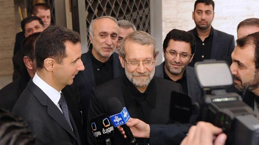 Syria's President Bashar al-Assad (L) and Iran's Parliament speaker Ali Larijani (C) speak to the media after meeting in Damascus November 23, 2012, in this handout photograph released by Syria's national news agency (SANA). REUTERS/SANA/Handout  (SYRIA - Tags: POLITICS) FOR EDITORIAL USE ONLY. NOT FOR SALE FOR MARKETING OR ADVERTISING CAMPAIGNS. THIS IMAGE HAS BEEN SUPPLIED BY A THIRD PARTY. IT IS DISTRIBUTED, EXACTLY AS RECEIVED BY REUTERS, AS A SERVICE TO CLIENTS