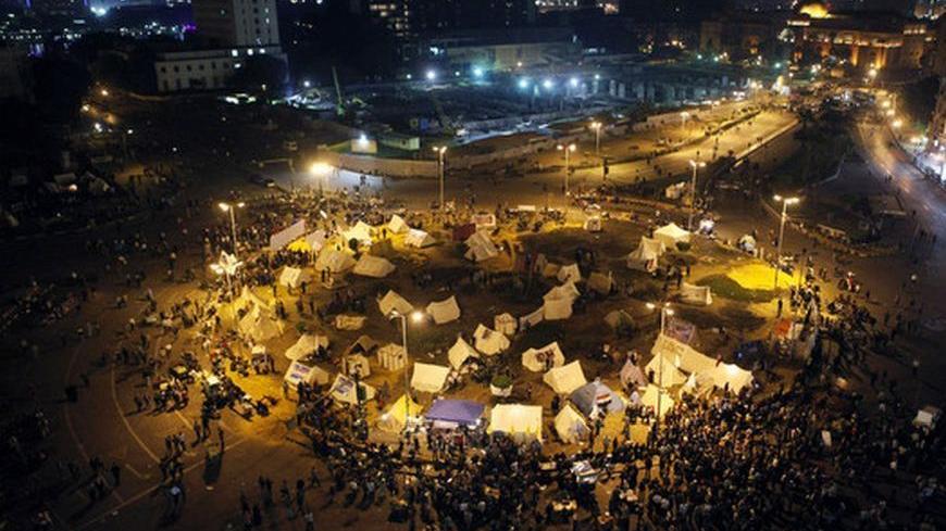 General view of tents in Tahrir square as protesters and activists continue with their sit-in, in Cairo, November 25, 2012. More than 500 people have been injured in protests since Friday, when Egyptians awoke to news Mursi had issued a decree temporarily widening his powers and shielding his decisions from judicial review. REUTERS/Asmaa Waguih (EGYPT - Tags: POLITICS CIVIL UNREST)