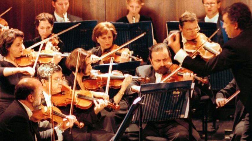 Italian Conductor Umberto Benedetti Michel Angeli conducts the Lebanese National Symphony Orchestra during a concert at the al-Bustan Festival in Beit-Mery near Beirut on February 20, 2001. Michel Angeli treated the opening night crowd to a selection of time-honoured classics including Vivaldi's Four Seasons and a little bit of Mozart.

JS