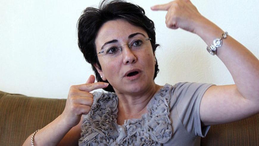 Haneen Zoabi, an Arab member of the Israeli Knesset (the Israeli parliament), talks to reporters in Amman August 31, 2010. Zoabi is in Amman to contribute to a UN fact-finding mission with Jordanian activists about Israel's May 31 capture of a Gaza-bound boat in which nine people died. The hearings, chaired by a 3-person panel commenced on August 30 in Amman with Arab activists from Israel, including Zoabi, who was aboard the Turkish vessel when the raid occurred. REUTERS/Muhammad Hamed (JORDAN - Tags: POLI