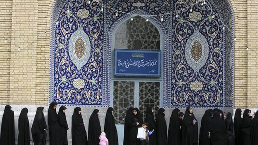 EDITORS' NOTE: Reuters and other foreign media are subject to Iranian restrictions on leaving the office to report, film or take pictures in Tehran.

Women stand in line to cast their votes during the parliamentary election, in the court yard of the holy shrine in Qom, 120 km (75 miles) south of Tehran March 2, 2012. Iranians voted on Friday in a parliamentary election which is expected to reinforce the power of the clerical establishment of Supreme Leader Ayatollah Ali Khamenei over hardline political ri