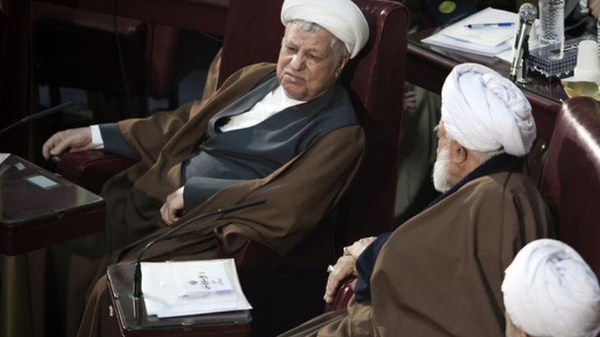 EDITORS' NOTE: Reuters and other foreign media are subject to Iranian restrictions on their ability to film or take pictures in Tehran.
Iran's former President Akbar Hashemi Rafsanjani (L) attends Iran's Assembly of Experts' biannual meeting in Tehran March 6, 2012. REUTERS/Raheb Homavandi  (IRAN - Tags: POLITICS)