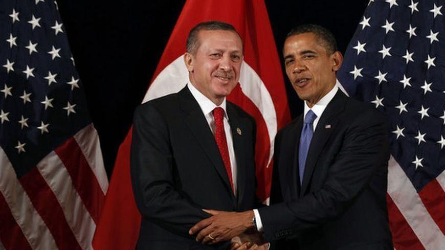 U.S. President Barack Obama (R) shakes hands with Turkey's Prime Minister Tayyip Erdogan after a bilateral meeting in Seoul March 25, 2012. Both leaders will attend the 2012 Nuclear Security Summit in Seoul on Monday. REUTERS/Larry Downing  (SOUTH KOREA - Tags: POLITICS MILITARY)