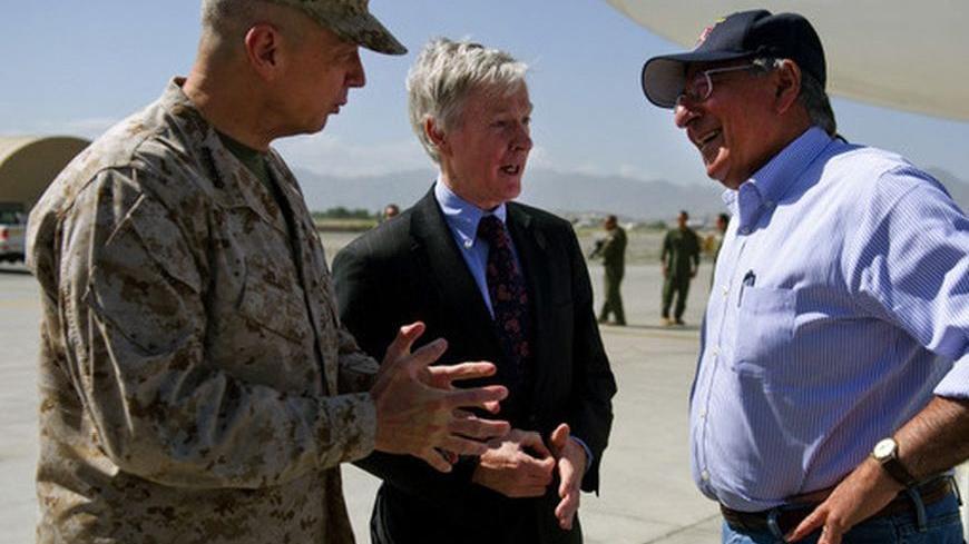 U.S. Defense Secretary Leon Panetta (R) speaks with U.S. Ambassador to Afghanistan Ryan Crocker and General John Allen (L), head of the NATO coalition forces in Afghanistan, upon his arrival at Kabul International Airport June 7, 2012. Panetta arrived in Afghanistan on Thursday for talks with military leaders amid rising violence in the war against the Taliban and a spate of deadly incidents, including a NATO air strike said to have killed 18 villagers. REUTERS/Jim Watson/Pool (AFGHANISTAN - Tags: MILITARY 
