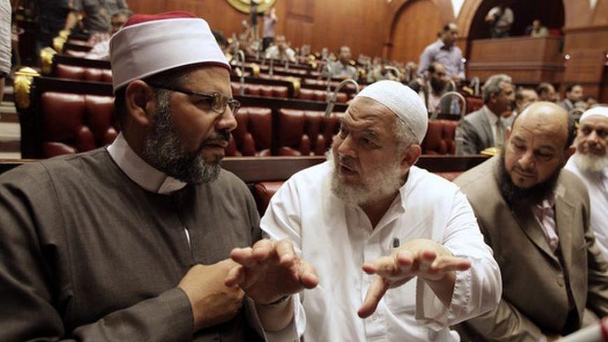 Abd Elrahman Elbar (L) and Saeed Abd Elazeem (2nd L), members of the committee drafting Egypt's new constitution, speak at the Shura Council in Cairo September 11, 2012.  REUTERS/Mohamed Abd El Ghany (EGYPT - Tags: POLITICS)