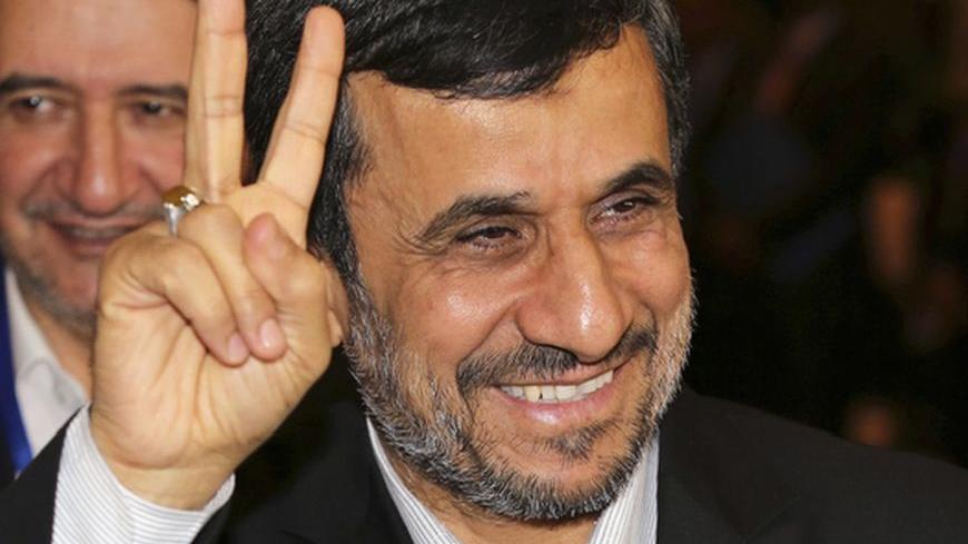 Iranian President Mahmoud Ahmadinejad gestures to photographers after meeting with Indonesian counterpart Susilo Bambang Yudhoyono in Nusa Dua, Bali November 9, 2012. Ahmadinejad said on Thursday the age of nuclear deterrence was long gone and any country still stockpiling nuclear weapons was "mentally retarded". He again denied Iran was trying to develop nuclear weapons, a day after the re-election victory of U.S. President Barack Obama, for whom Tehran's disputed nuclear programme will be one of the thorn
