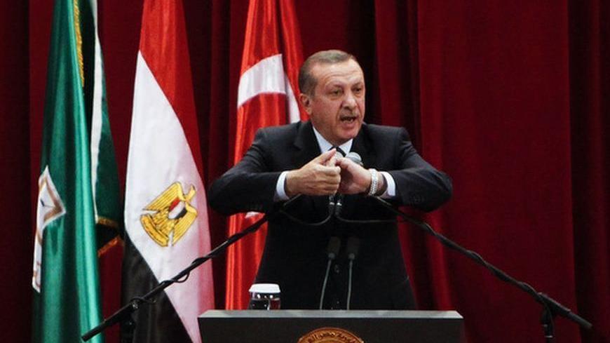 Turkish Prime Minister Tayyip Erdogan delivers a speech at Cairo University after his meeting with the Egyptian President Mohamed Mursi during the first day of his two-day trip to Egypt, November 17, 2012. Erdogan, an outspoken of critic of Israel, praised Egypt's Islamist president Mursi on Saturday for recalling his ambassador from Tel Aviv in response to Israeli attacks on Gaza. REUTERS/Asmaa Waguih (EGYPT - Tags: POLITICS TPX IMAGES OF THE DAY)
