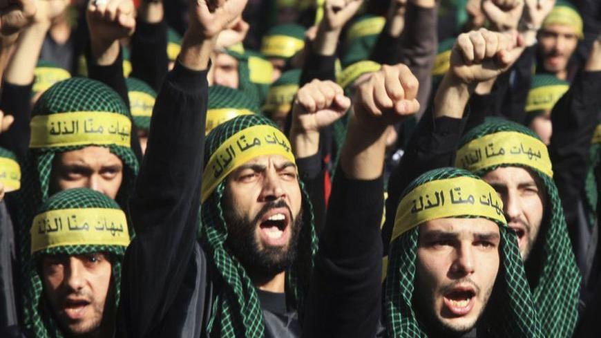 Lebanon's Hezbollah supporters gesture as they march during a ceremony to mark Ashura in Beirut's suburbs, November 25, 2012. Hezbollah leader Sayyed Hassan Nasrallah warned Israel on Sunday that thousands of rockets would rain down on Tel Aviv and other Israeli cities if Israel attacked Lebanon. In a speech marking the Shi'ite Muslim festival of Ashura, Nasrallah said Hezbollah's response to any attack would dwarf the attacks from Gaza during the eight-day conflict between Israel and the Islamist Hamas rul